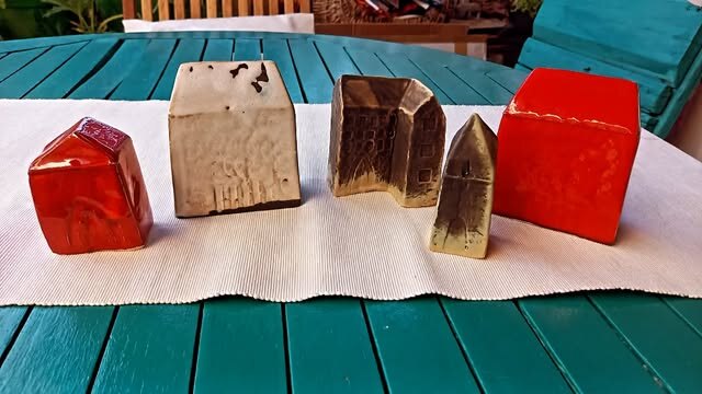 Small handmade wooden house sculptures