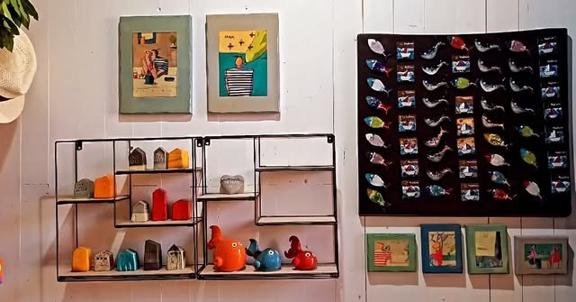 The interior of Calisto filled with colourful artworks and handmade objects